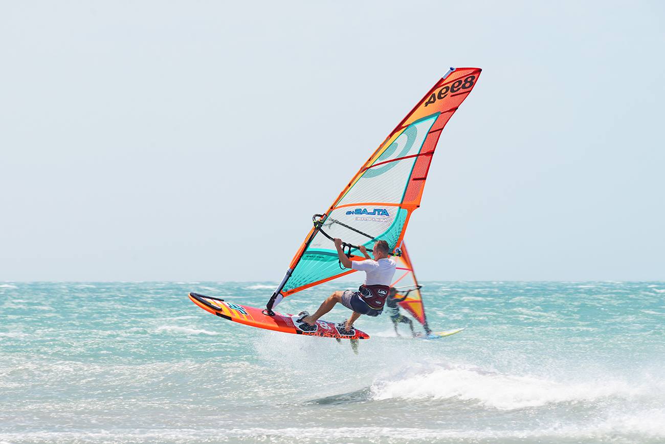 Photograph of person windsurfing in the ocean